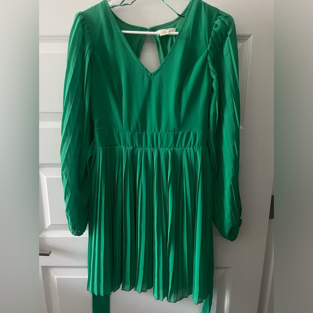 Green Jessica Simpson brand dress. Tie in back, cinched back with accent opening